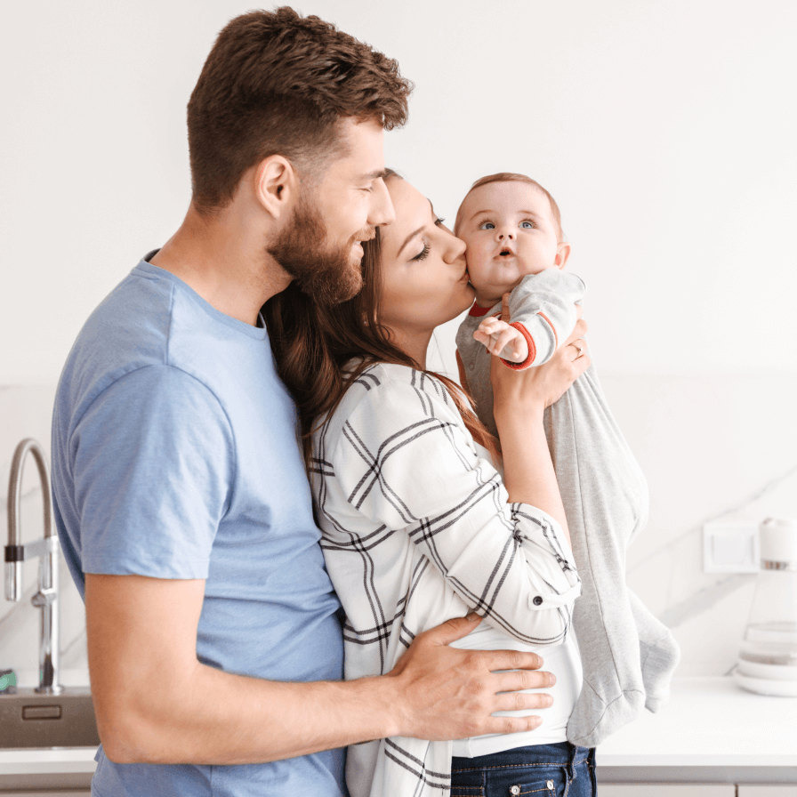 happy-parents-having-fun-with-their-little-baby-ZHEV3WG 1 (1)